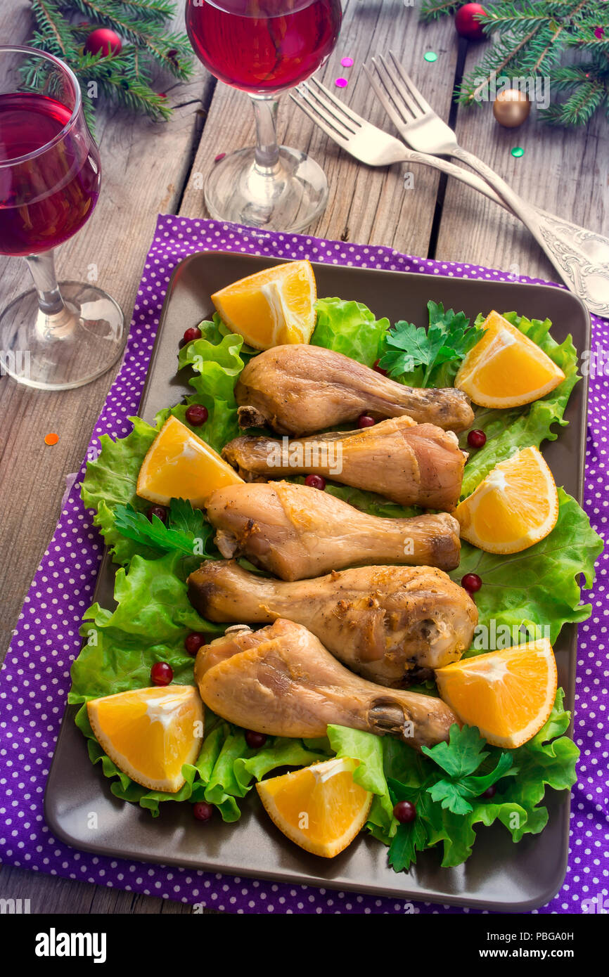 Dish With Roasted Chicken Legs Greens Oranges And Wine