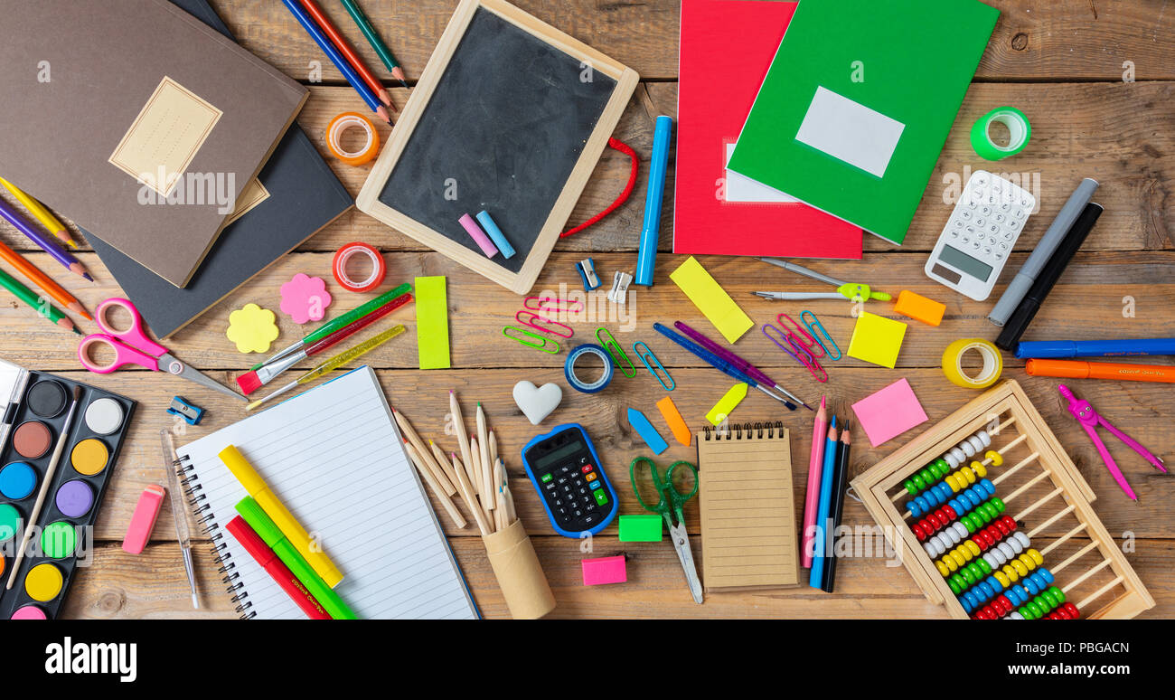 School supplies on wooden desk. Kid creativity flat lay Stock Photo by rawf8