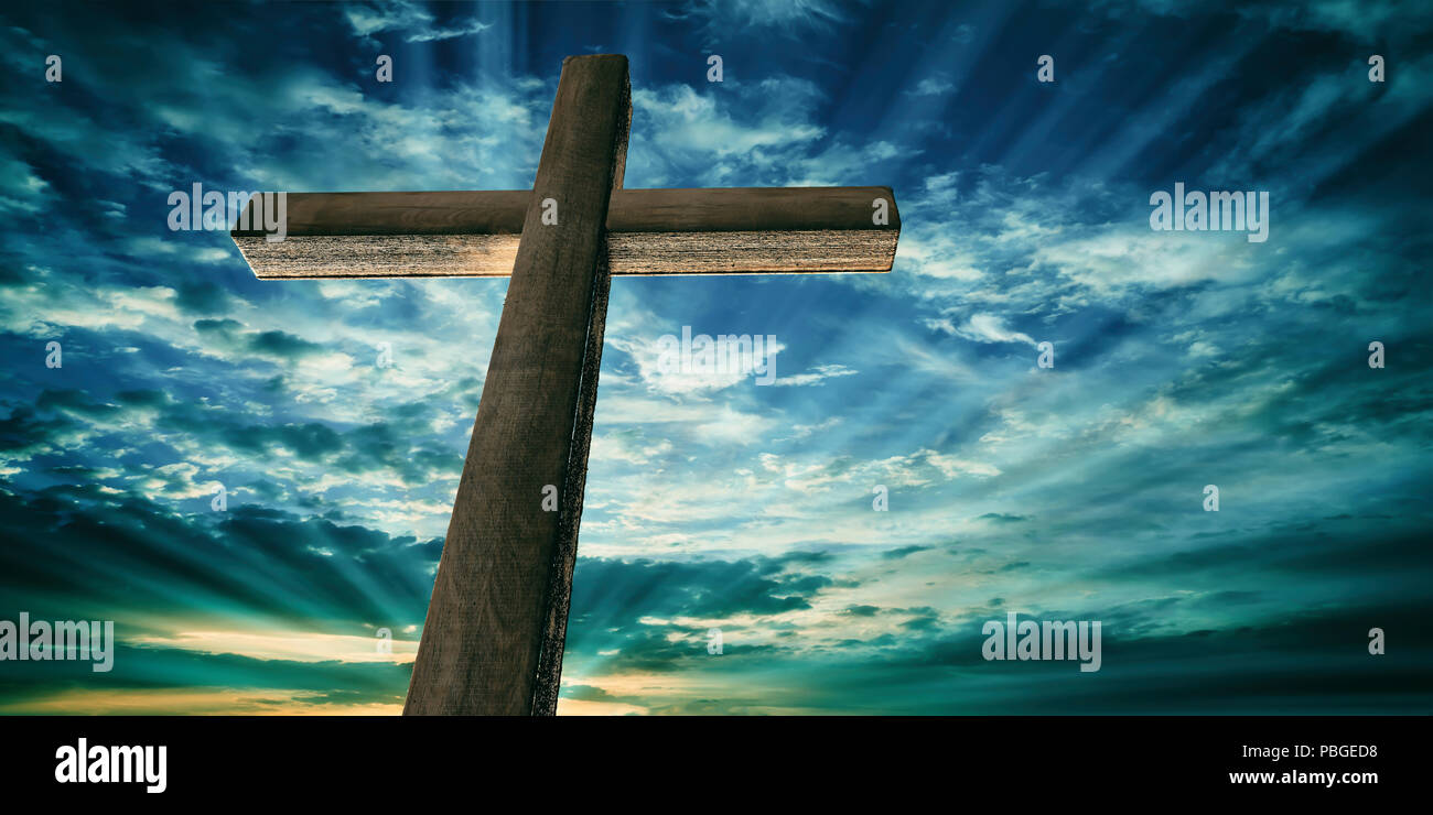Crucifixion of Jesus Christ. Wooden cross on sky at sunset background, copy  space. 3d illustration Stock Photo - Alamy