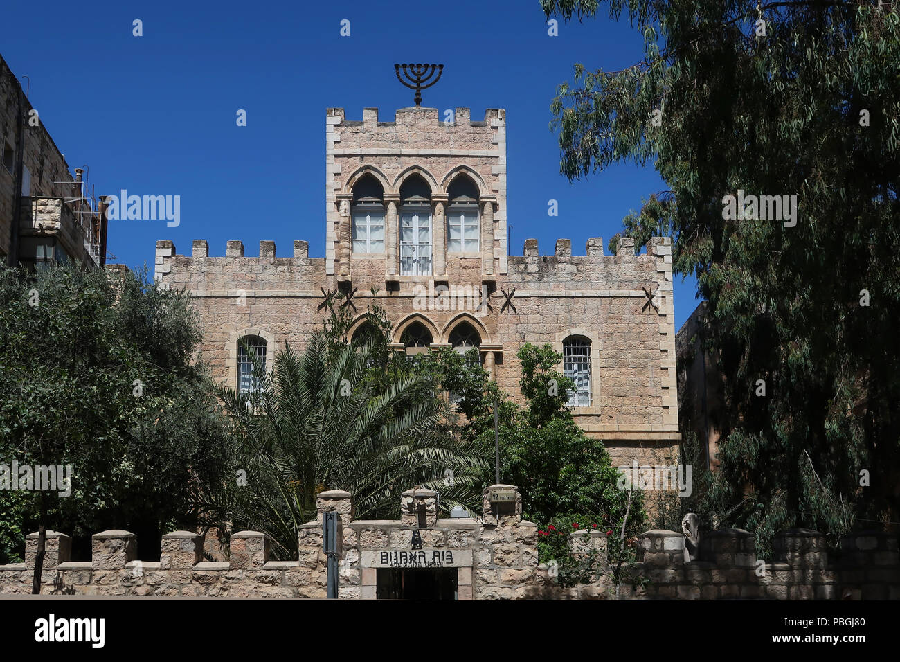 The Menorah, a seven branched candelabra one of the symbols of Judaism since ancient times on top of  the former Bezalel School of Art building, also called Artists House on Shmuel HaNagid Street. in West Jerusalem Israel Stock Photo