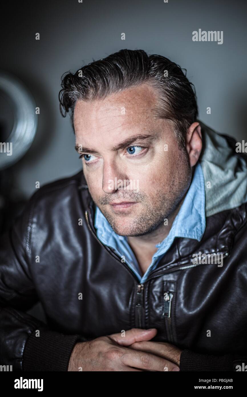portrait of a handsome man in a leather jacket Stock Photo