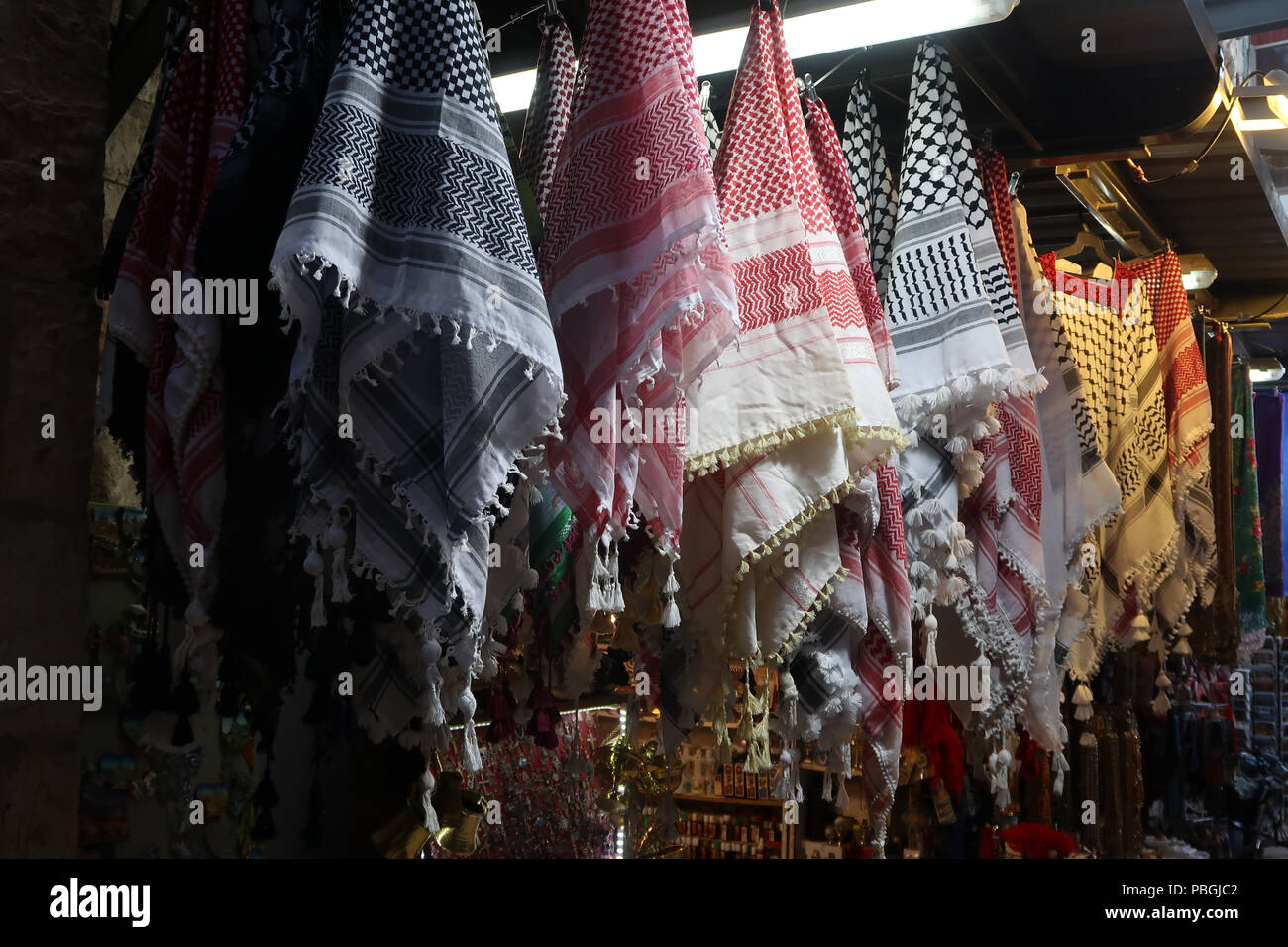 Traditional red or black and white checked keffiyeh for sale in the old city market east jerusalem israel