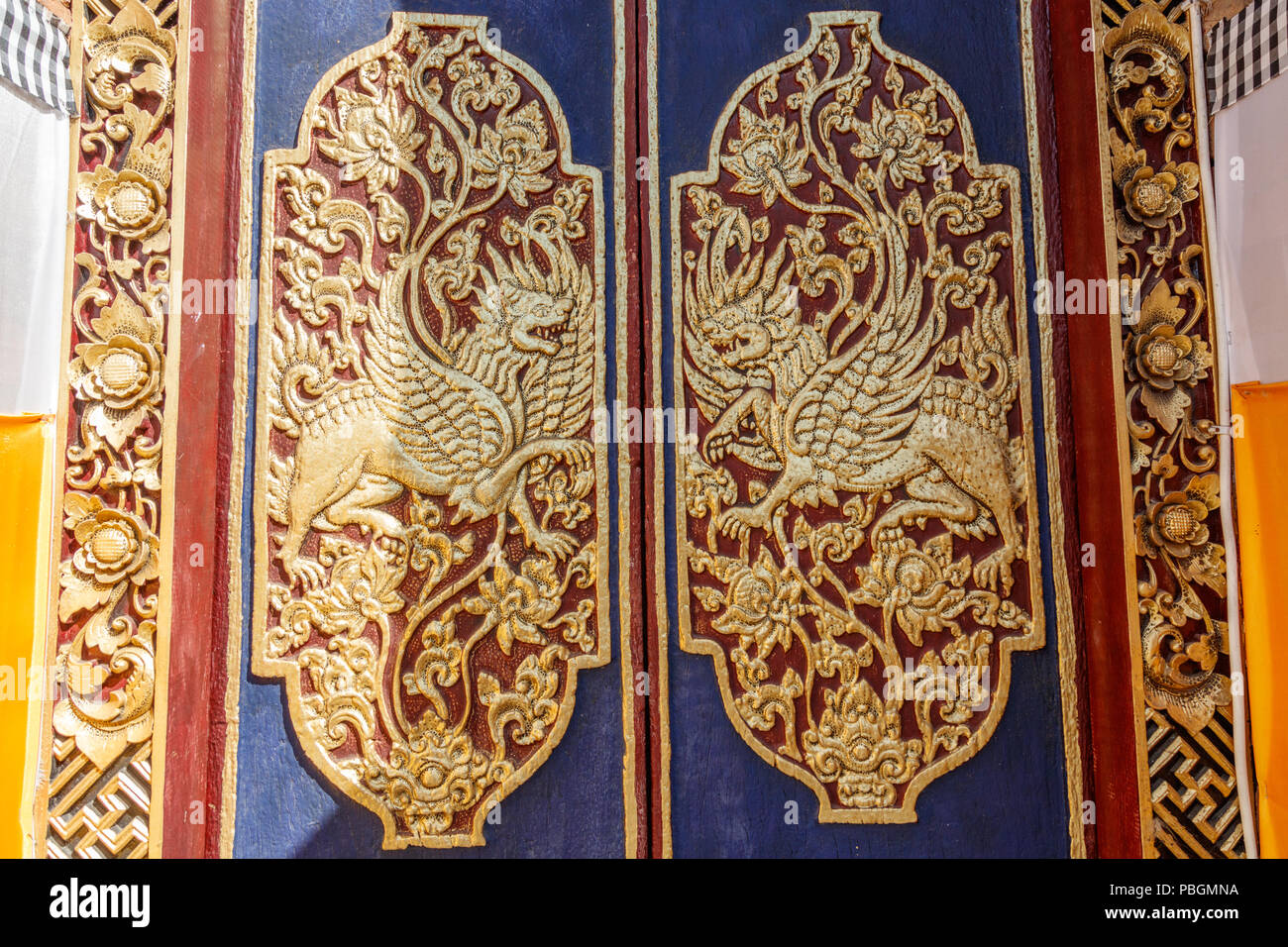 Carved wooden doors of the entrance gates of Hindu Balinese  temple, Buruan, Bali, Indonesia. Stock Photo