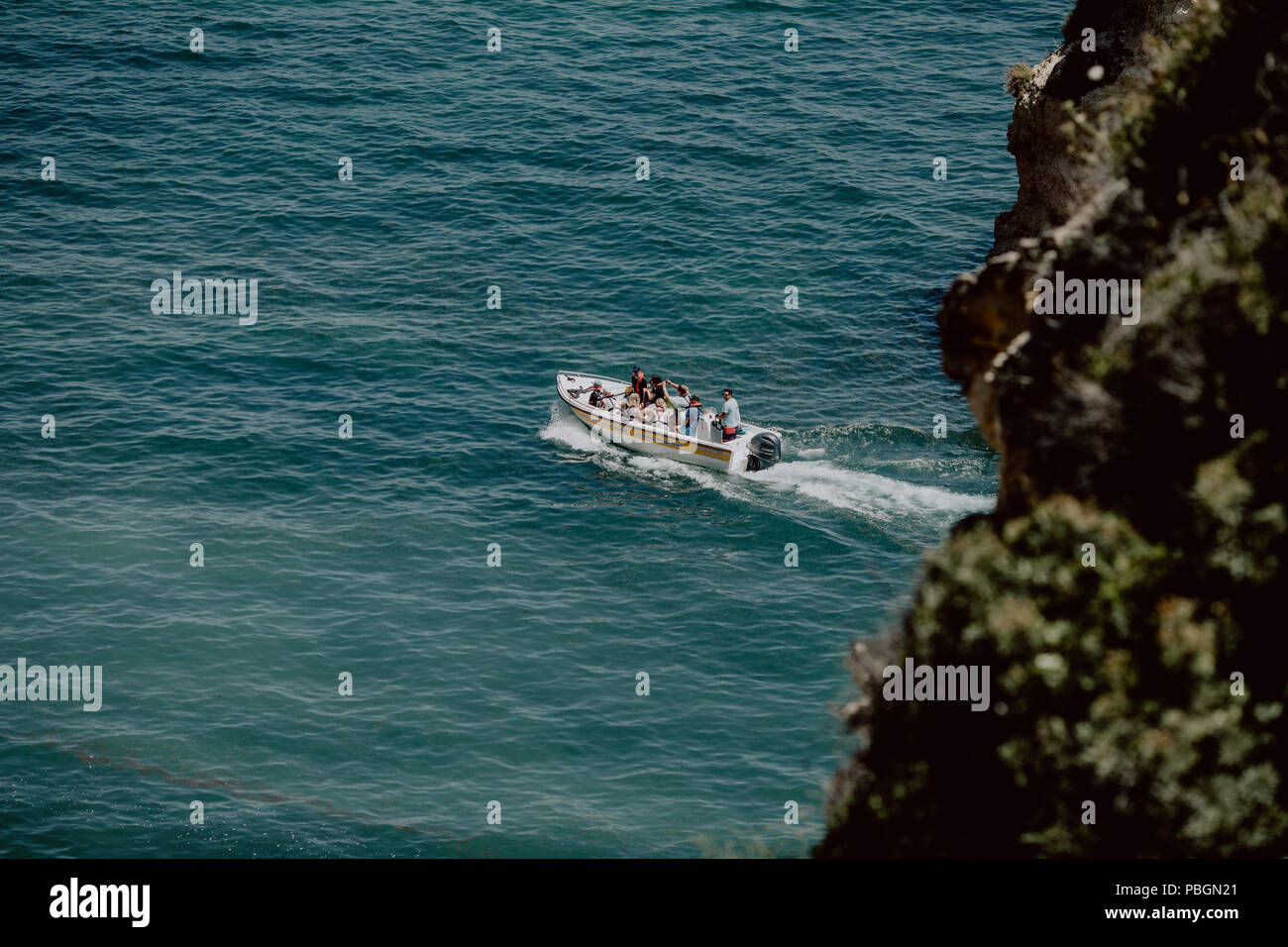 Top view of a white boat sailing in the blue sea Stock Photo - Alamy