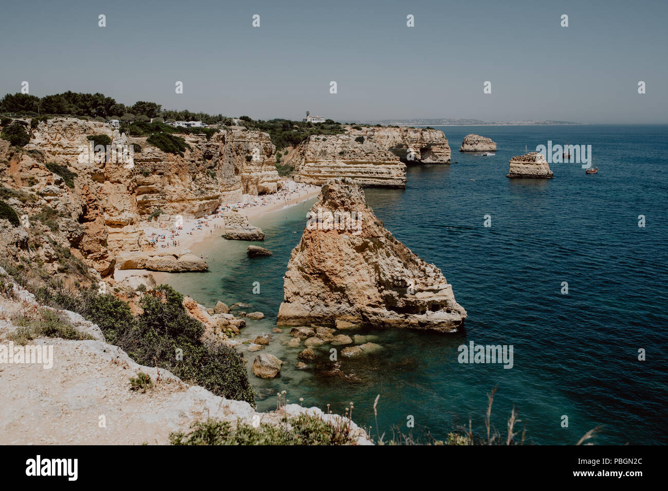 Aerial view of iconic natural arches of Praia da Marinha in Algarve