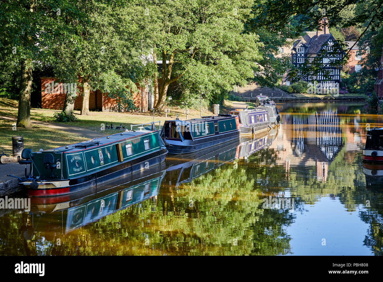 Worsley Bridgewater canal narrowboats reflecting in the clear water Stock Photo