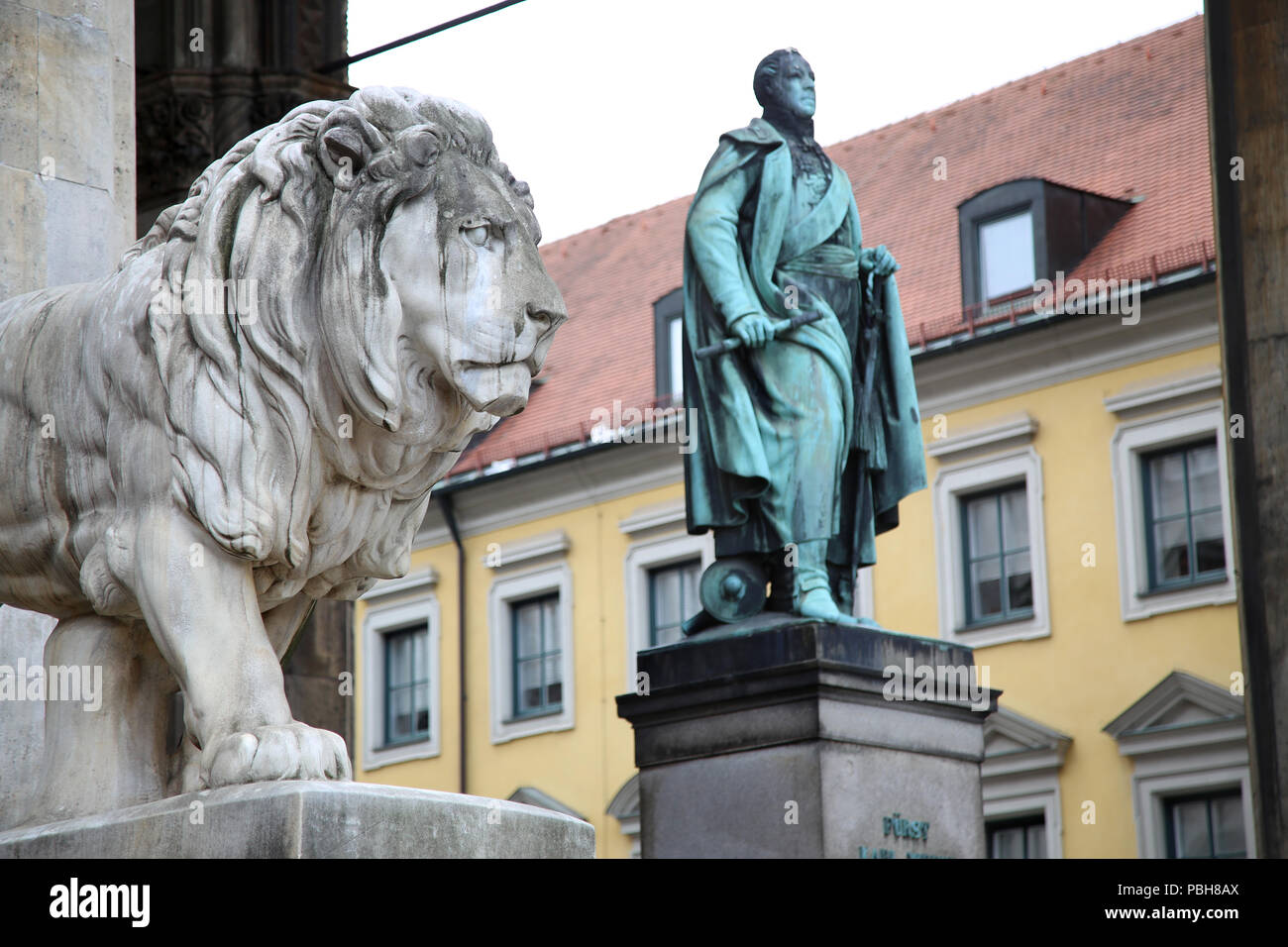 details of a stone lion sculpture and  Statue of Karl Wrede at the Odeonsplatz - Feldherrnhalle in Munich Germany Stock Photo