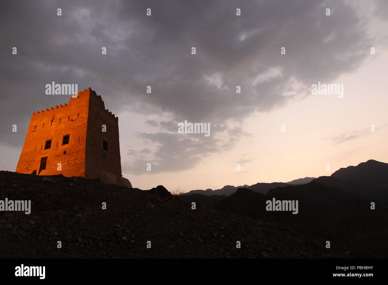 The historical Fort Hail is located deep in its valley, in the heart of the Al Hajar Mountains in the UAE emirates of Fujairah far from civilization. Stock Photo