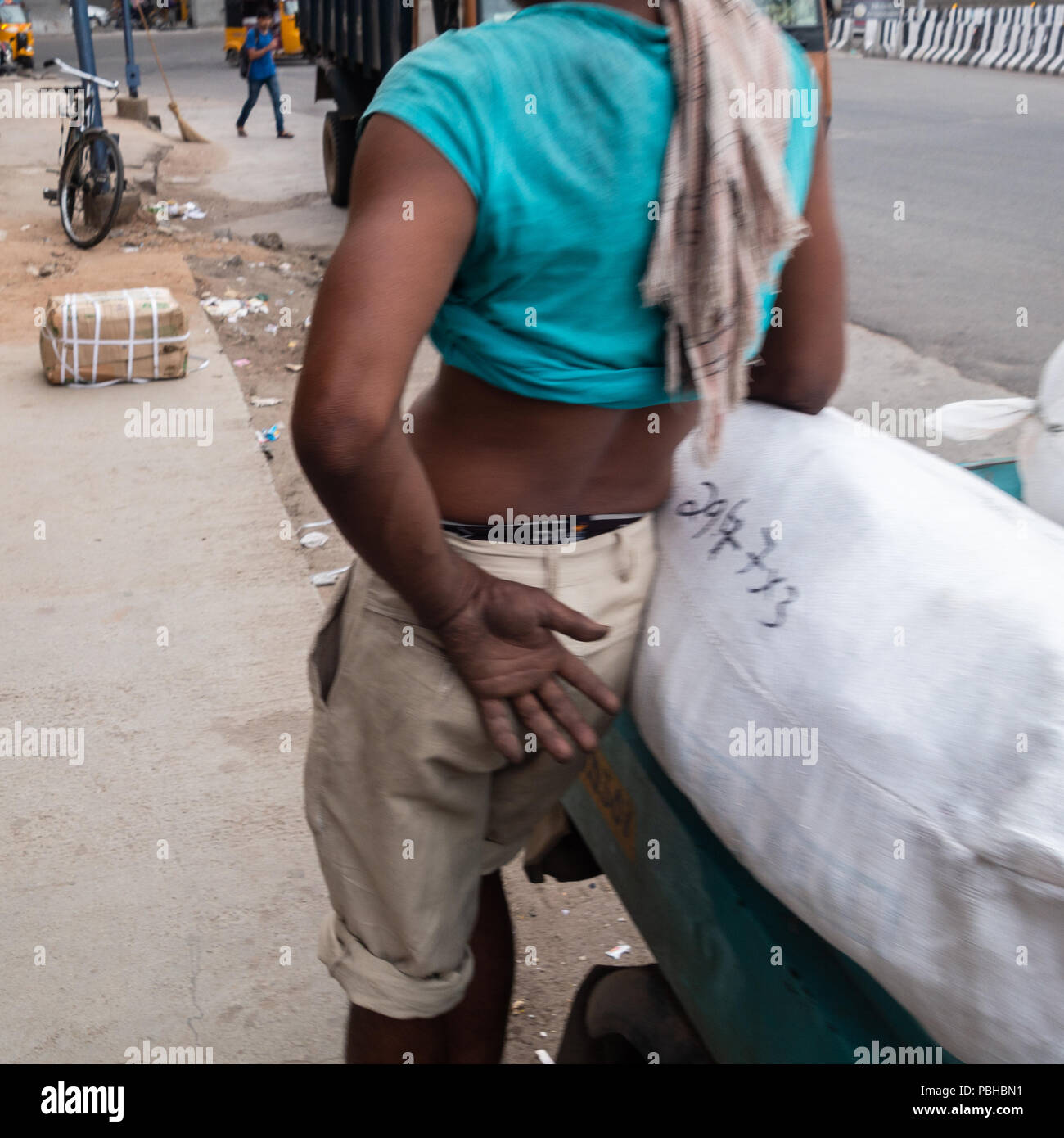 A porter standing on the street in Hyderabad,India Stock Photo