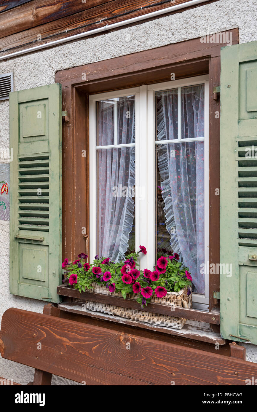 Colorful flowers in window boxes on an alpine cottage at Murren ...