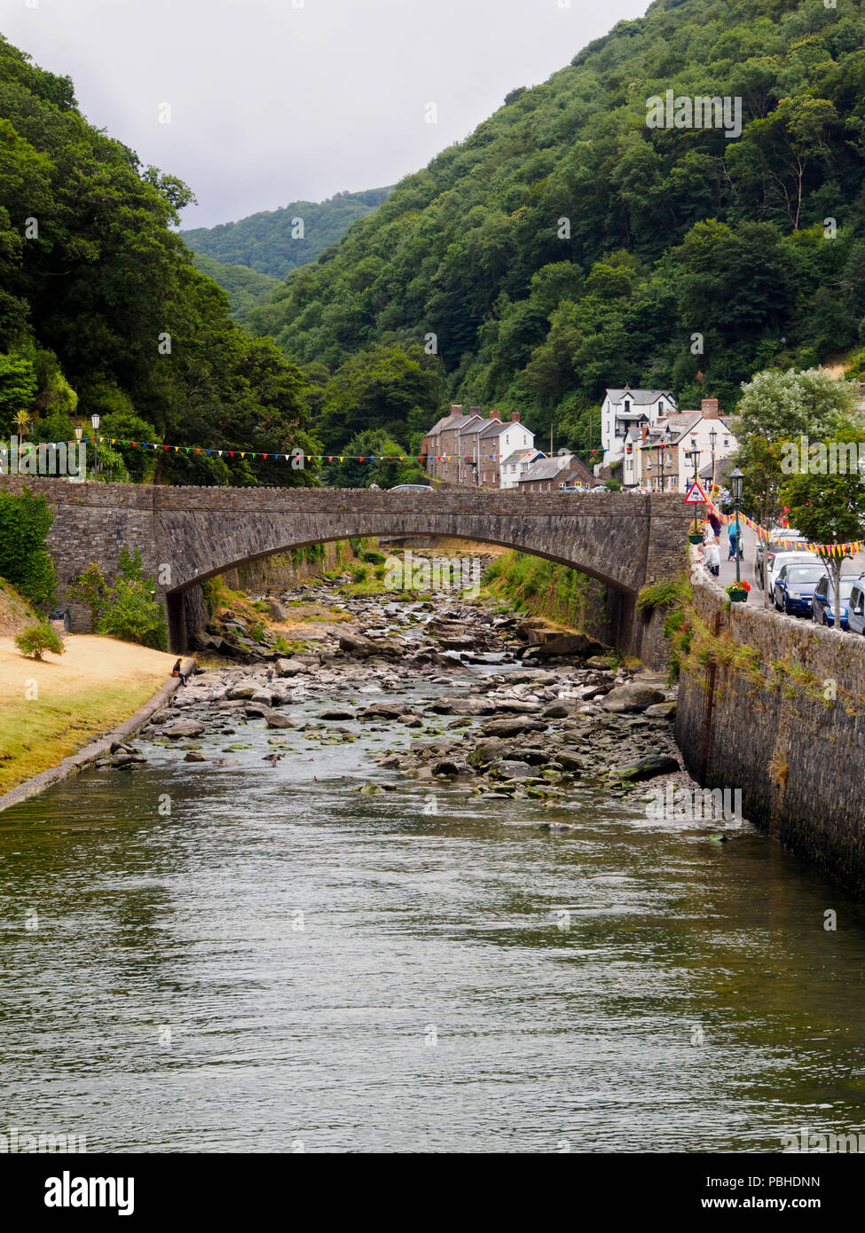 A39 Road bridge arches over the boulder strewn East Lyn river at Lynmouth, Devon, UK Stock Photo