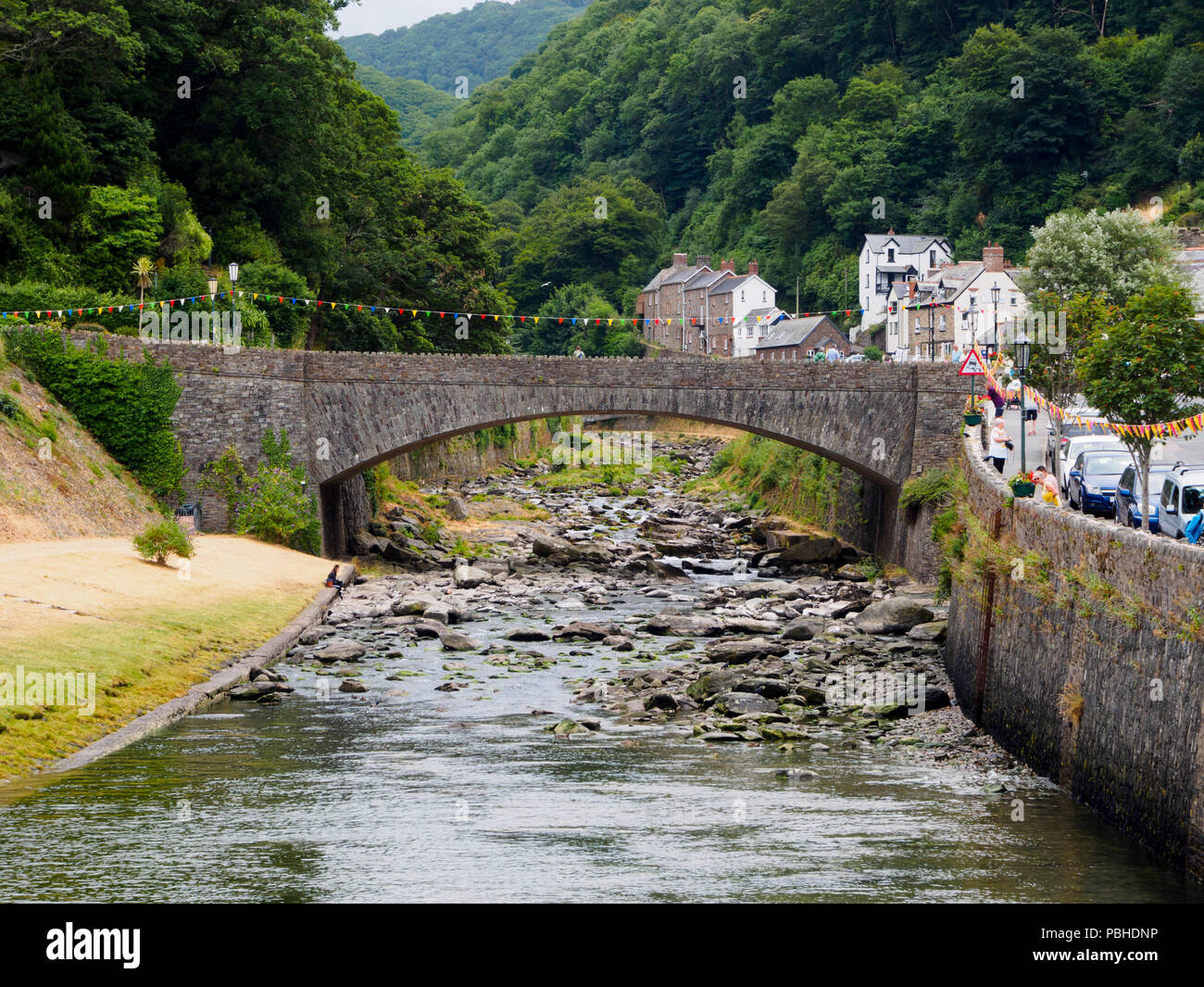 A39 Road bridge arches over the boulder strewn East Lyn river at Lynmouth, Devon, UK Stock Photo
