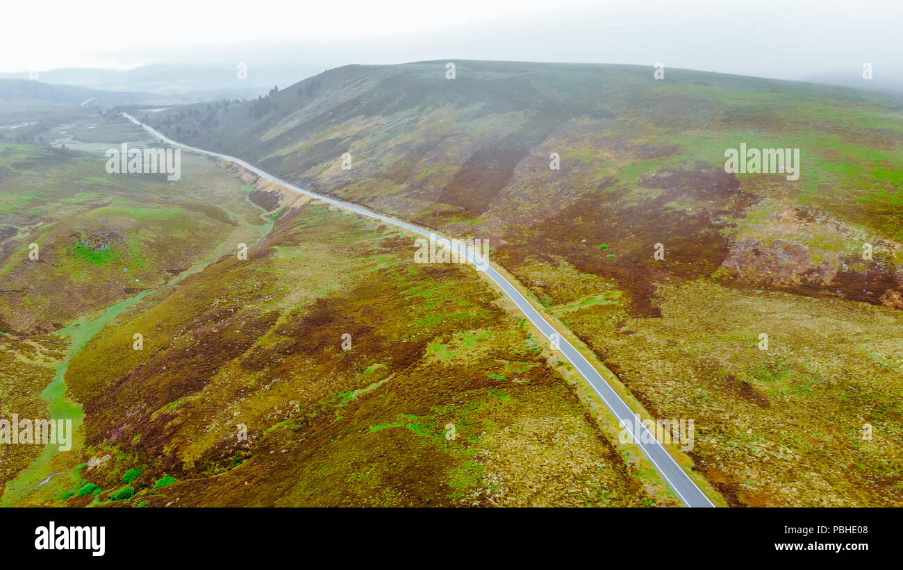 Lonesome road through the Scottish Highlands - typical scenery Stock Photo