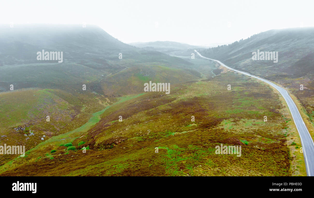 Lonesome road through the Scottish Highlands - typical scenery Stock Photo