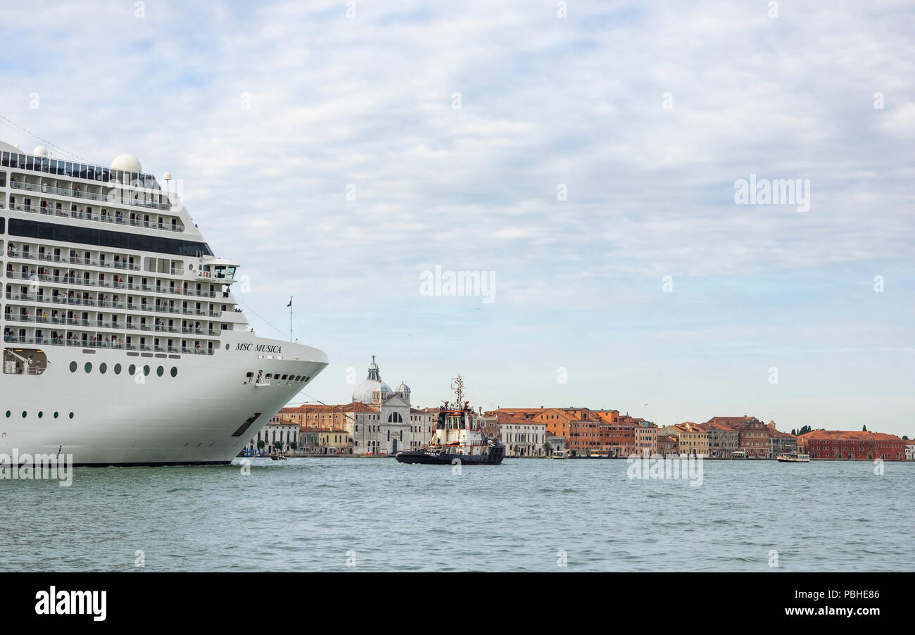 Luxury Liner and a tugboat Stock Photo