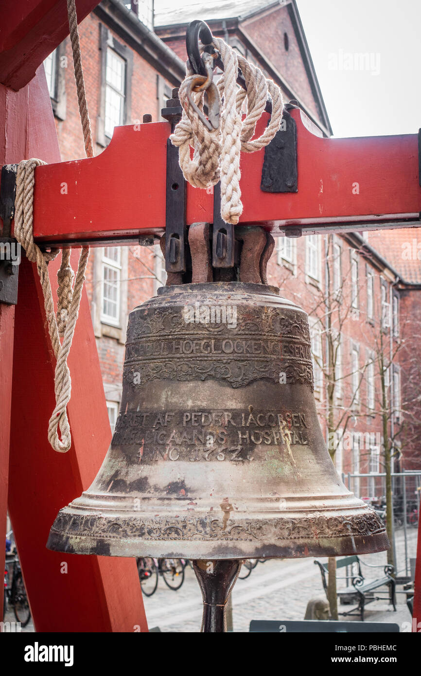 Church bell in the yard of Vartov, Copenhagen Stock Photo