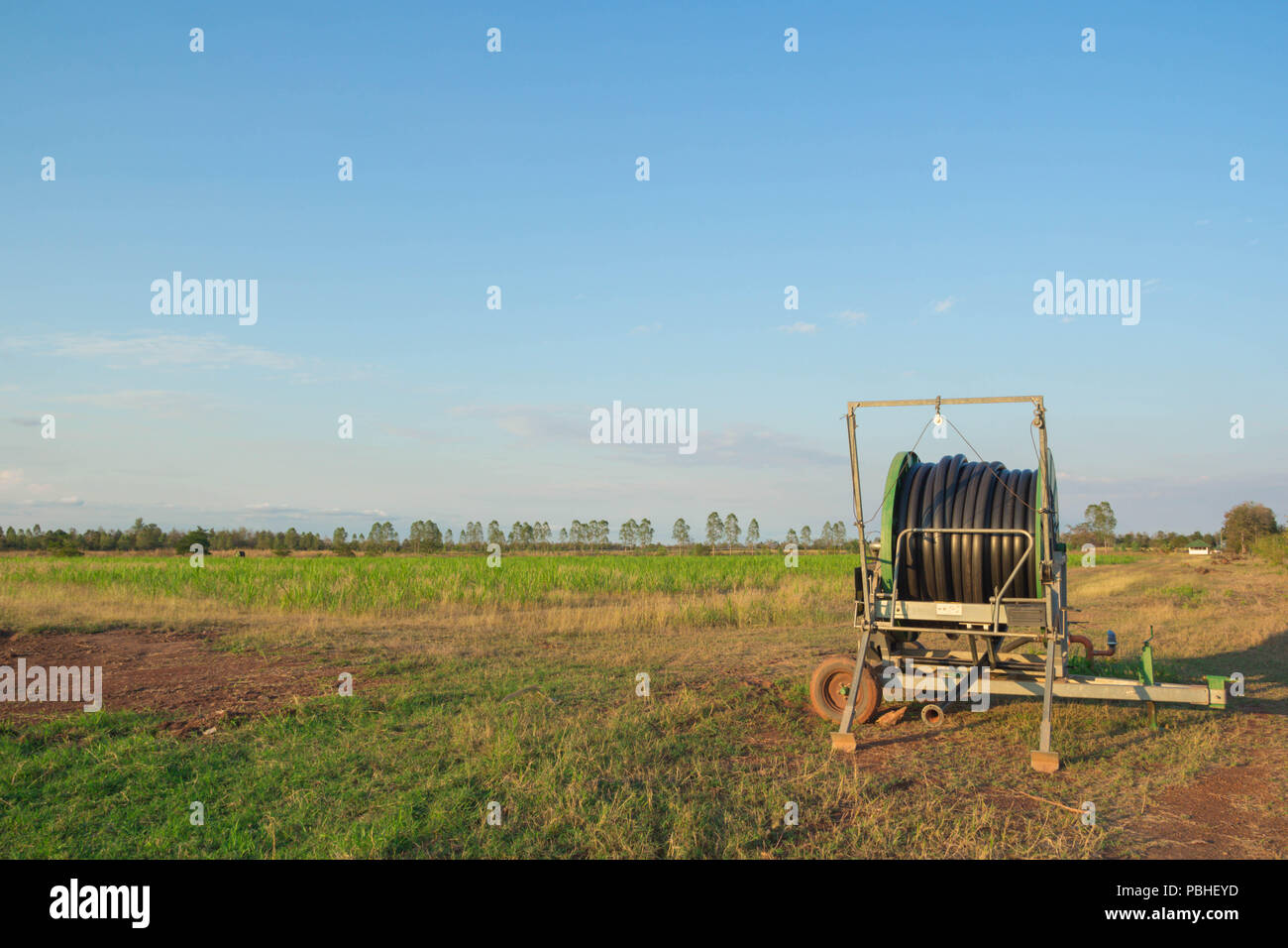 water pipeline on the agricultural field in spring. Stock Photo