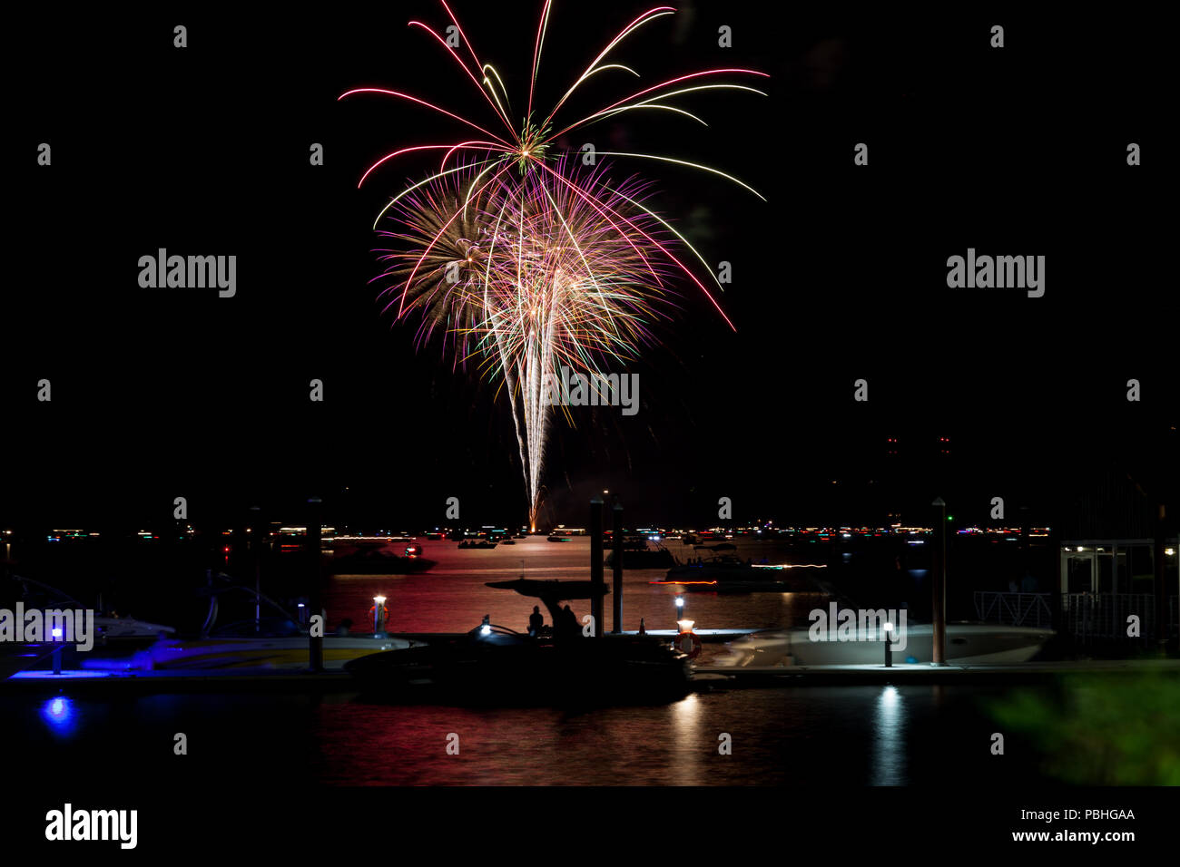 Beautiful Fourth of July fireworks glowing over Lake Coeur d'Alene in