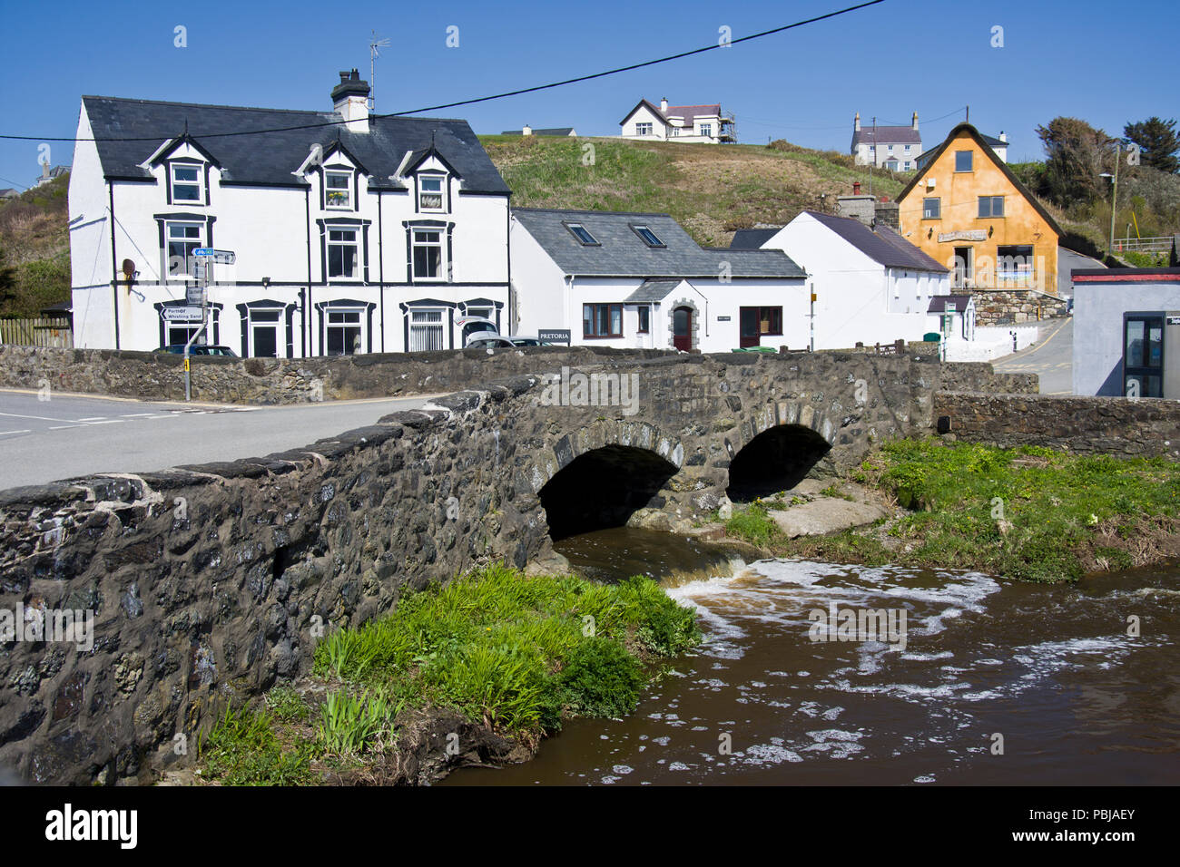 The bridge over the river Cyllyfelin where it joins the river Daron, in Aberdaron, Gwynedd, North Wales. Stock Photo