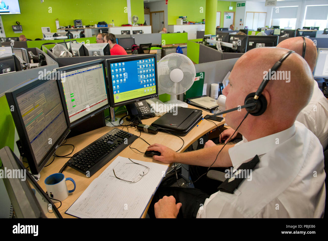 Avon & Somerset Police headquarters,showing the Communications (Comms) Room,where all operations are controlled,with duty force incident manager,left Stock Photo