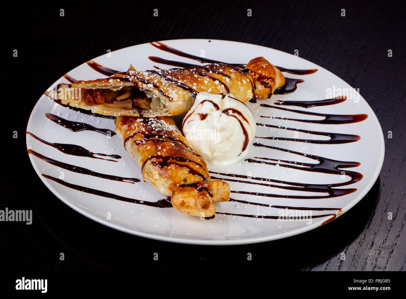 Delicious scotch pie with raisins, with ice cream, chocolate syrup