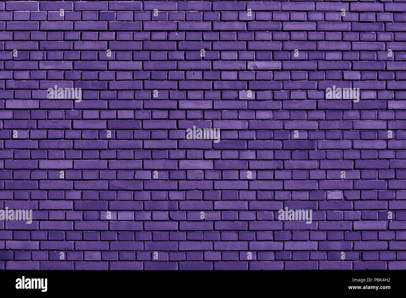 Ultra Violet colored brick wall background Stock Photo