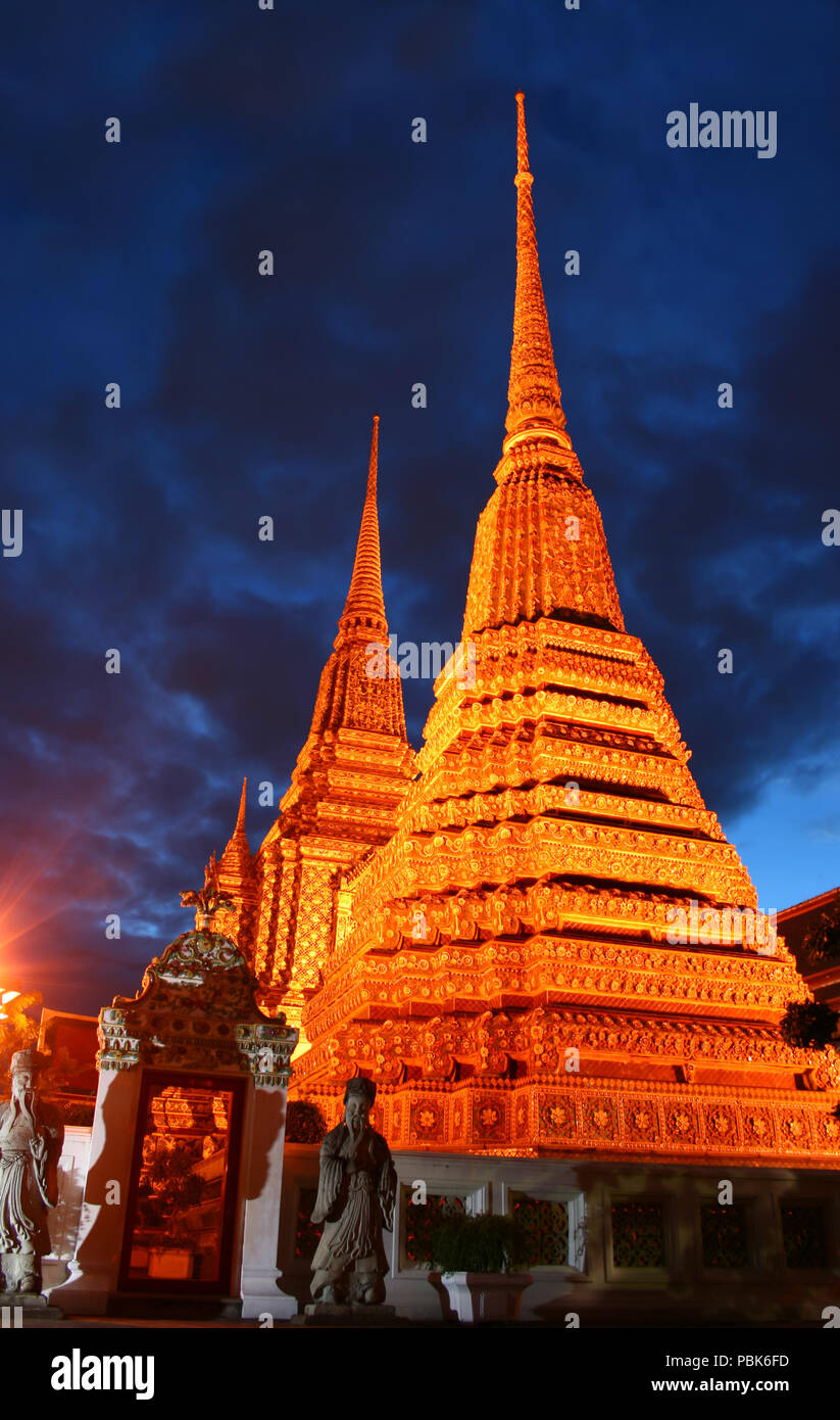 The pagodas of Wat Pho temple at night. Bangkok, Thailand Stock Photo ...