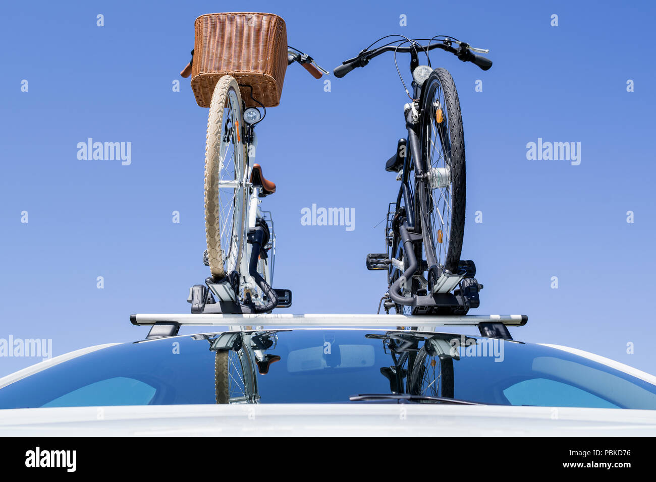 bicycle rack on top of white car Stock Photo Alamy