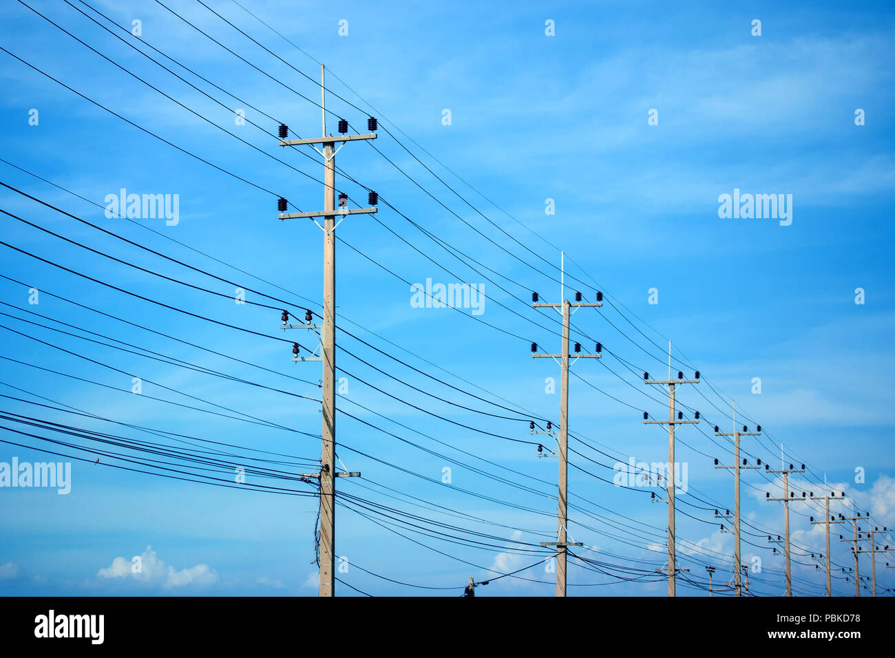 Power lines on the blue sky Stock Photo - Alamy