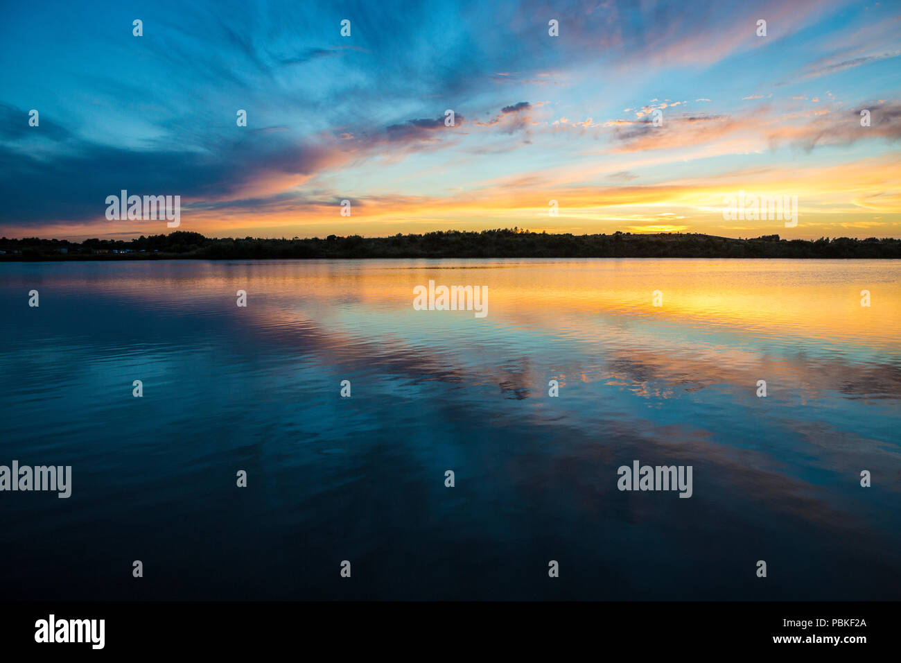 Colourful sunset and cloud reflections at Cliff Lakes, Tamworth, England, UK Stock Photo Alamy