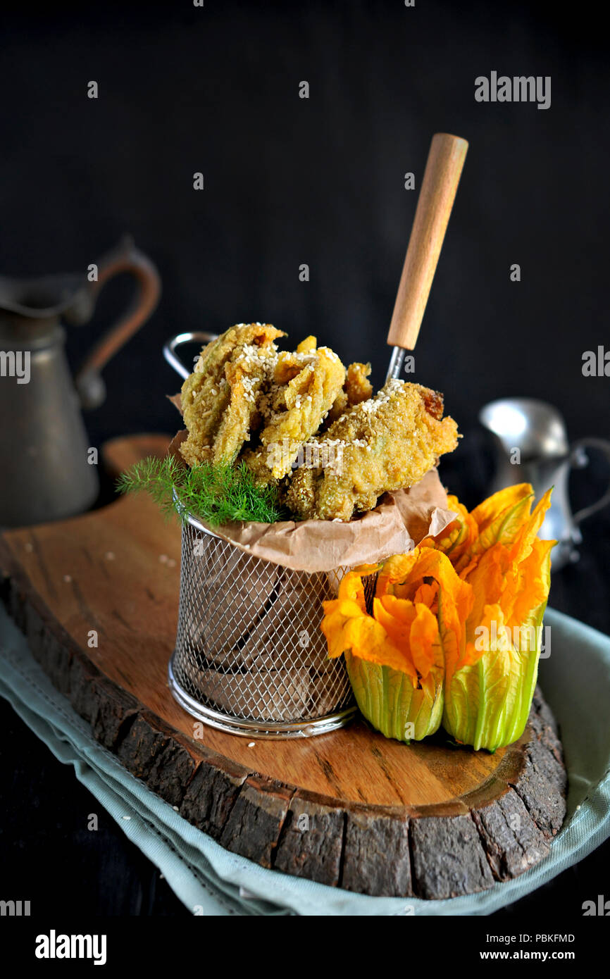 Flowers of pumpkin and zucchini fried, Traditional Italian cuisine. Copy space Stock Photo Alamy