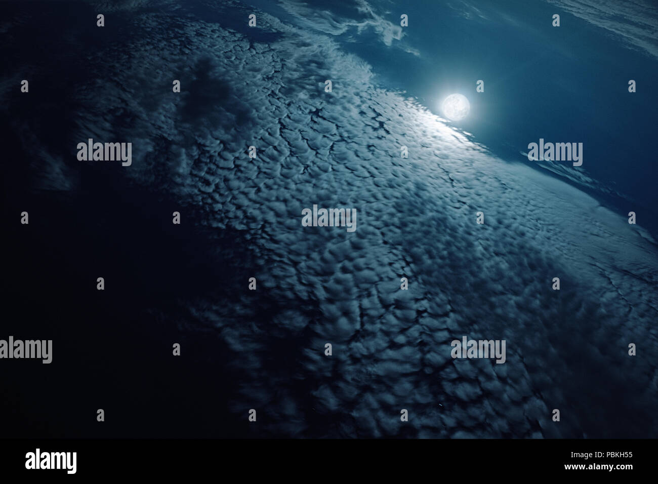 Aerial view of the moon rising over a cloudscape Stock Photo - Alamy