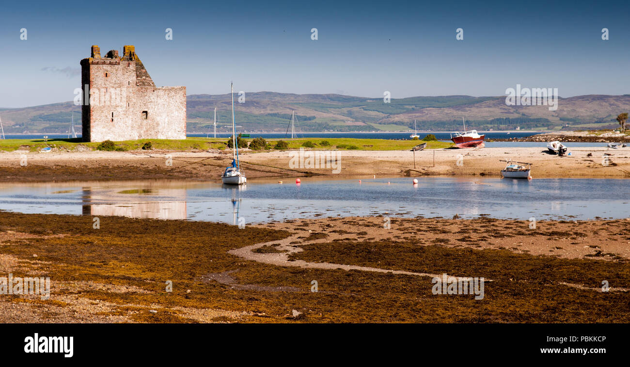 Lochranza Castle, a 13th century tower house, stands on the beach