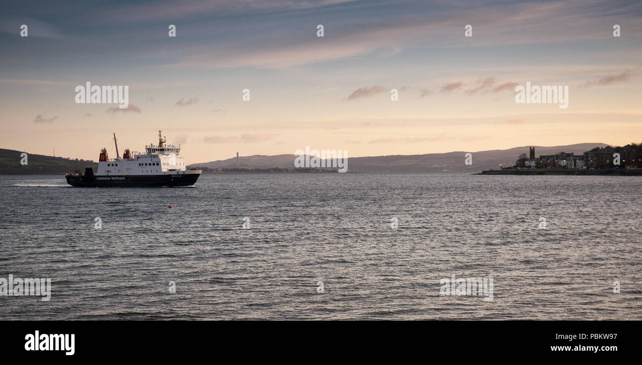 Rothesay, Scotland, UK - January 12, 2012: A CalMac ferry crosses the Firth of Clyde to Rothesay on the Isle of Bute, on the west coast of Scotland. Stock Photo