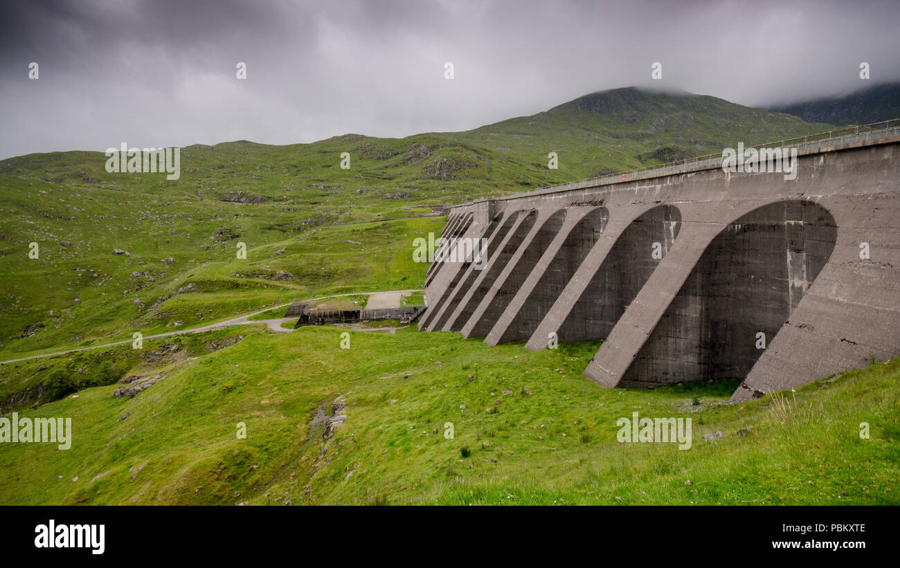 The concrete dam of Cruachan pumped storage hydroelectric power station high on the side of Ben Cruachan mountain in the West Highlands of Scotland. Stock Photo