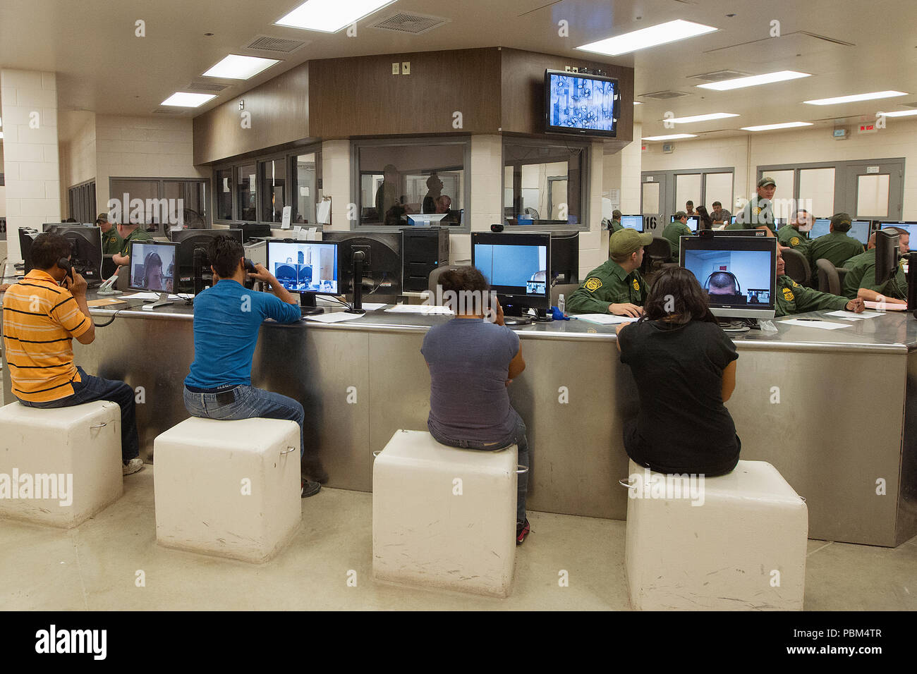 South Texas aliens who crossed the border illegally are assisted at the Customs Processing Center to determine their particular situation and solution for placement. Stock Photo