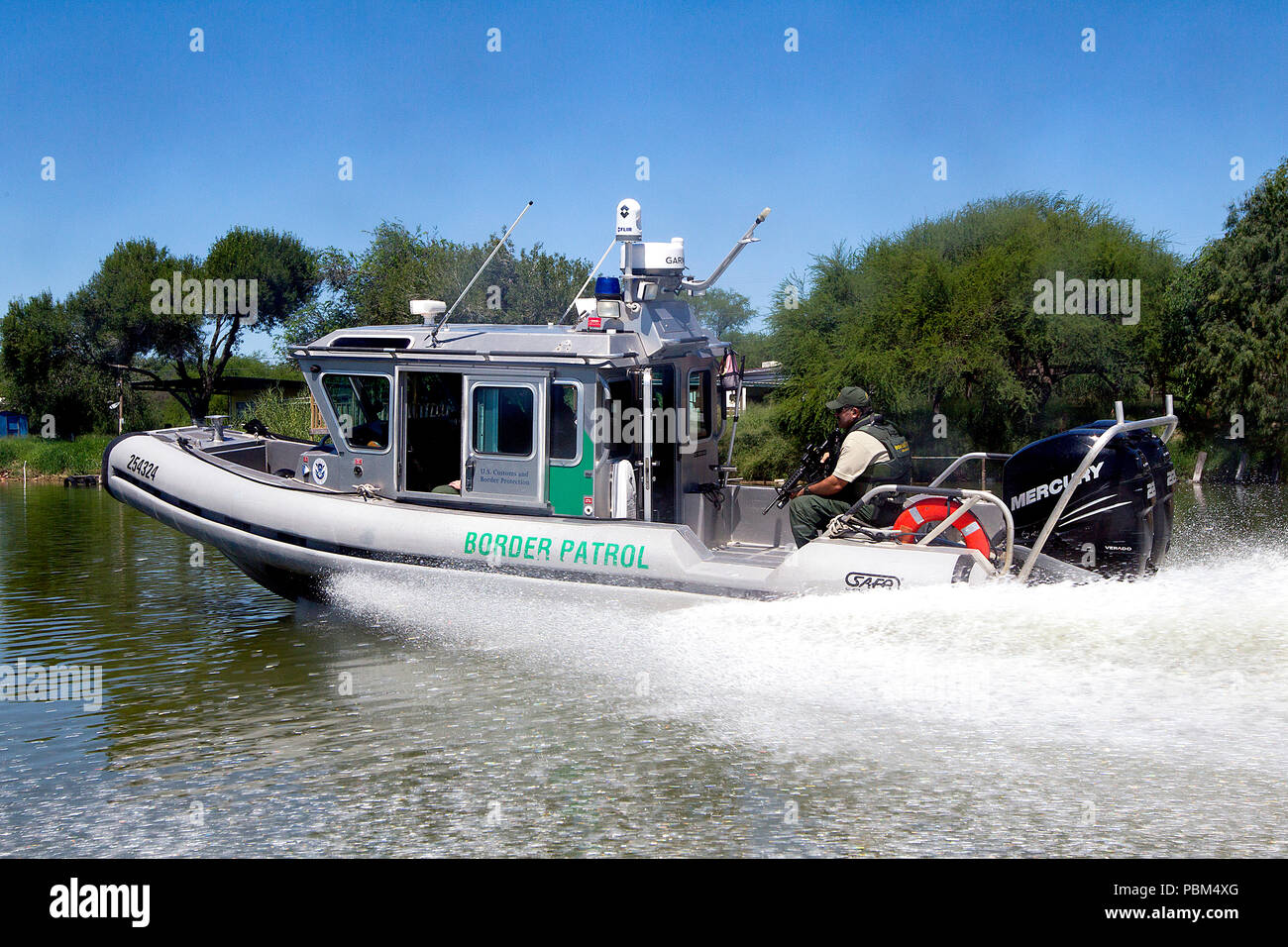 Border Patrol conducts patrols in a Safe-Boat in South Texas, McAllen, along the Rio Grande Valley river on September 24, 2013. Stock Photo