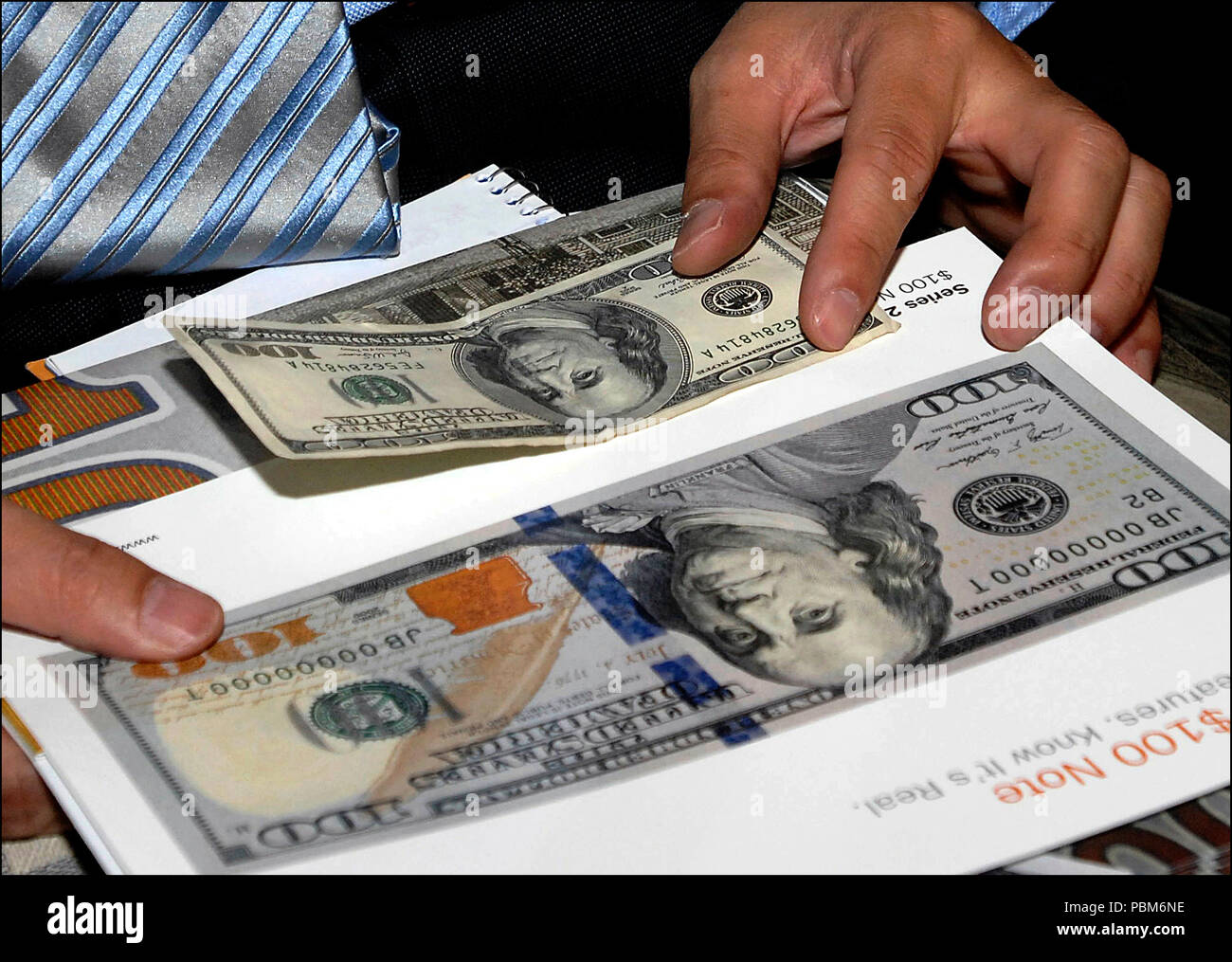 Comparing one hundred dollar bills hires stock photography and images Alamy