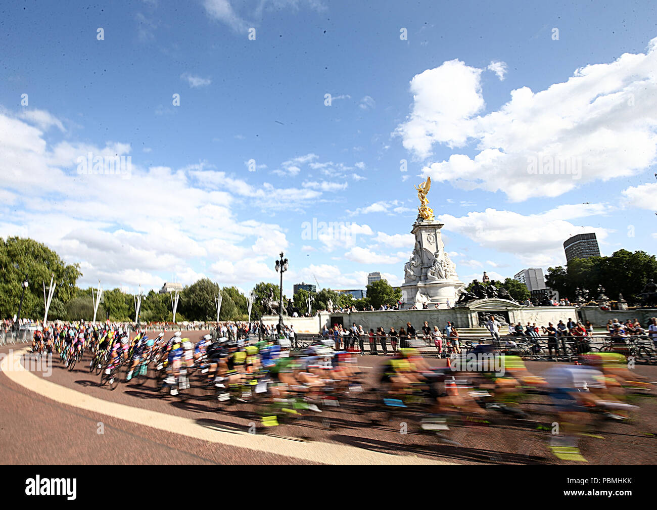 Rider make their way past the Queen Victoria Memorial during the Prudential RideLondon, Classique during day one of the Prudential Ride London. Stock Photo