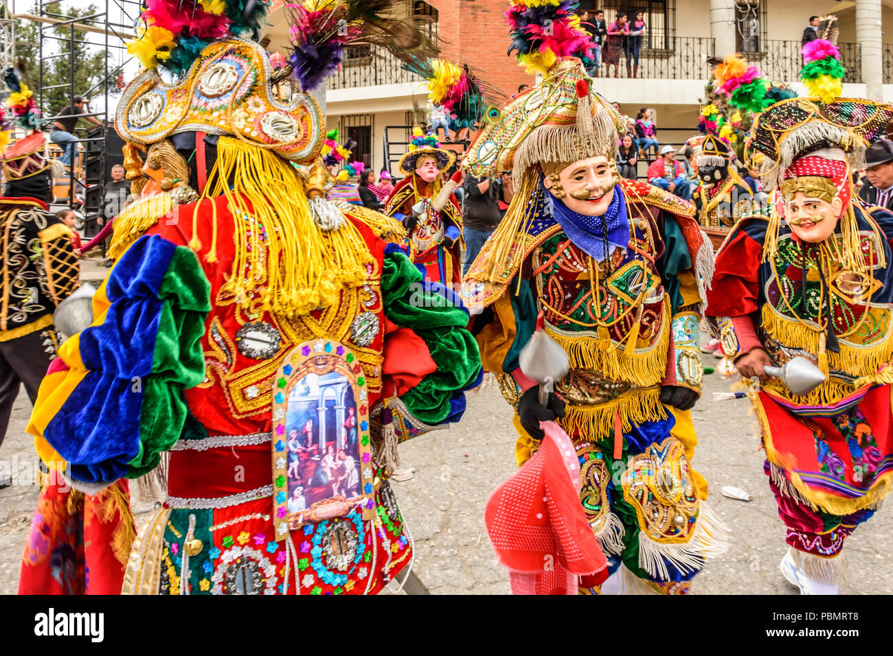 Parramos, Guatemala - December 28, 2016: Traditional folk dancers in mask & costume in Dance of the Moors & Christians near colonial Antigua. Stock Photo