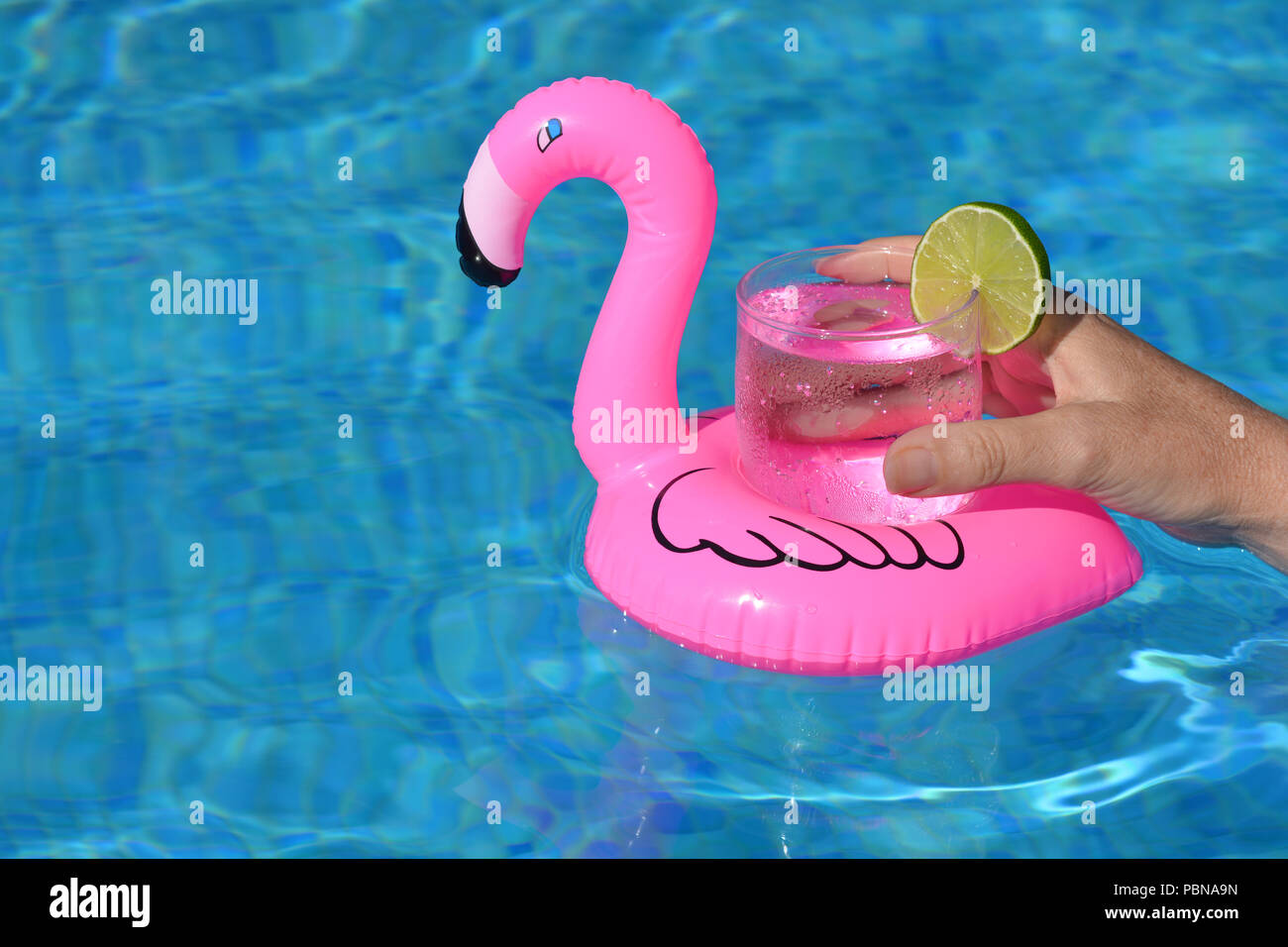 Woman floating water inflatable flamingo hi-res stock photography and  images - Alamy