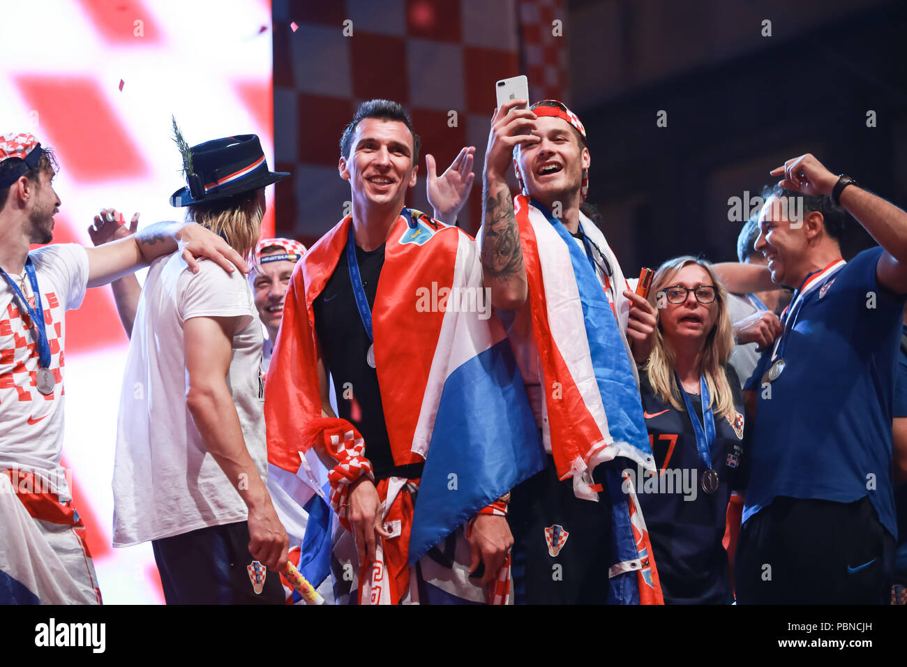 ZAGREB, CROATIA - JULY 16, 2018 : Croatia National Football Team welcome home celebration - Mario Mandzukic and Duje Caleta Car celebrating on the sta Stock Photo