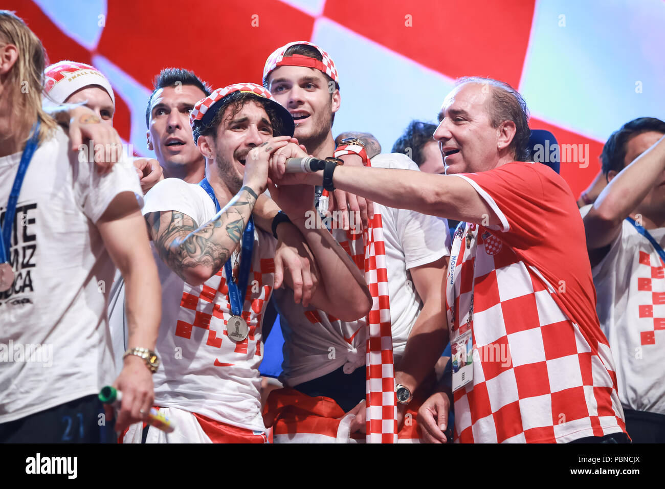 ZAGREB, CROATIA - JULY 16, 2018 : Croatia National Football Team welcome home celebration. Sime Vrsaljko, Duje Caleta Car singing together with singer Stock Photo