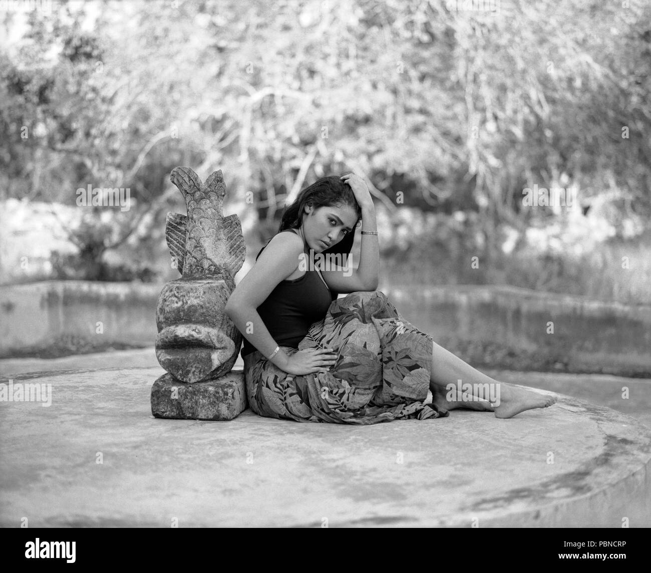 17 years old teenager girl in an outdoor, environmental portrait session. B&W medium format film. Stock Photo
