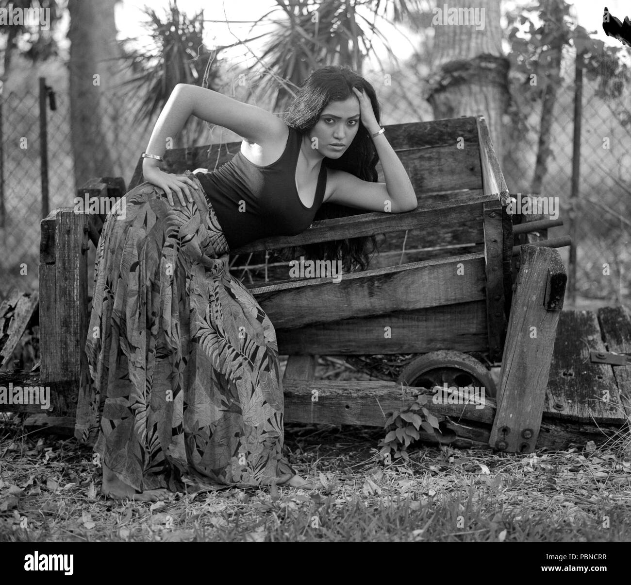 17 years old teenager girl in an outdoor, environmental portrait session. B&W medium format film. Stock Photo