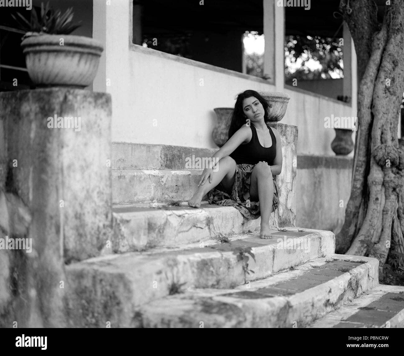 17 years old teenager girl in an outdoor, environmental portrait session. B&W medium format film. Stock Photo