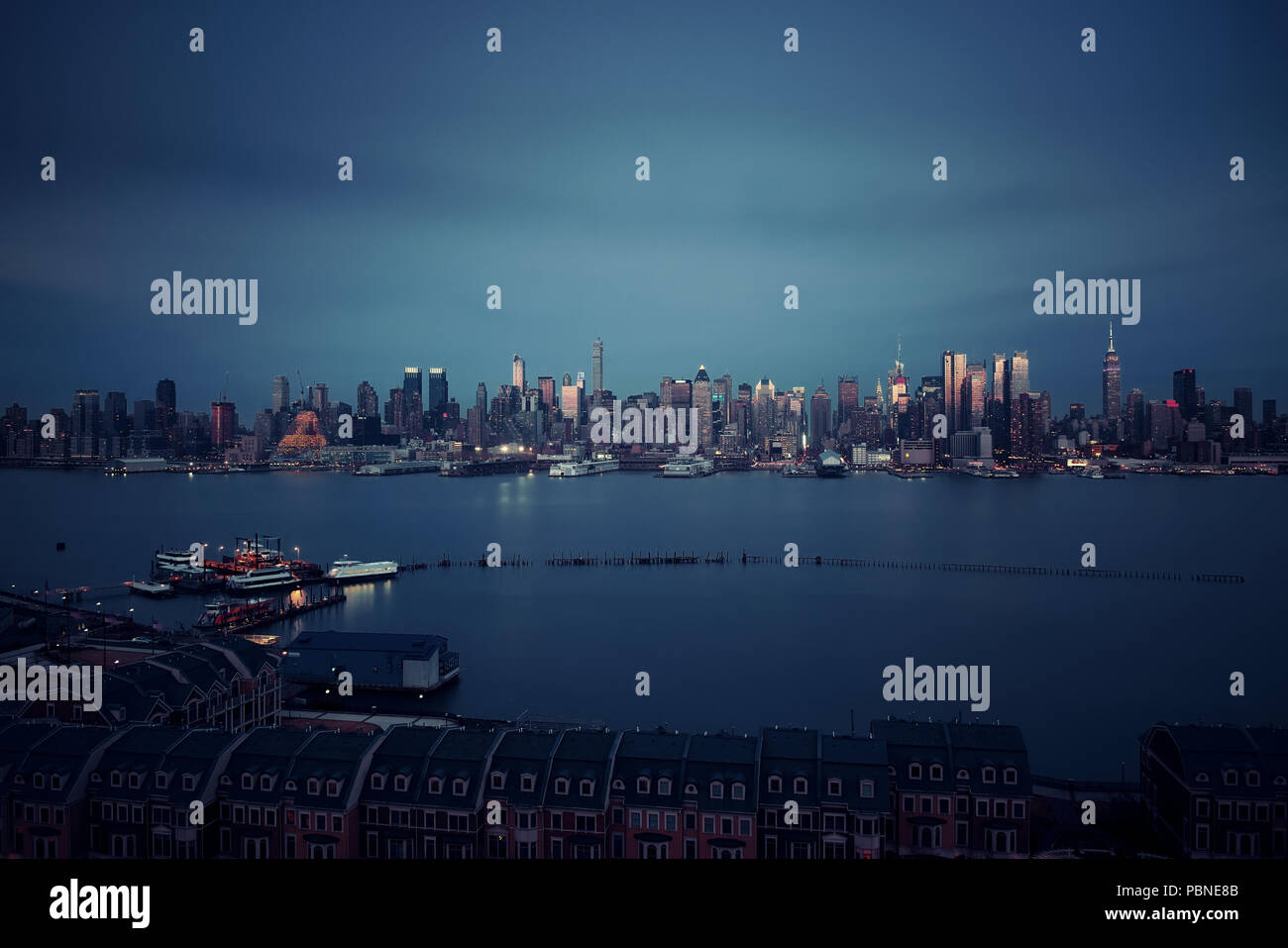 Midtown skyline over Hudson River in New York City with skyscrapers at ...