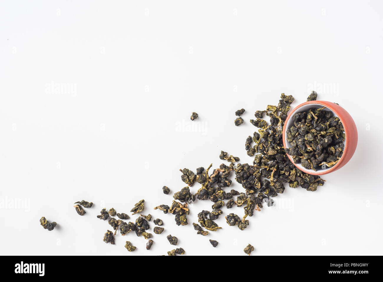 Asia culture and design concept - fresh taiwan oolong tea dry bud in chinese porcelain teacup Stock Photo