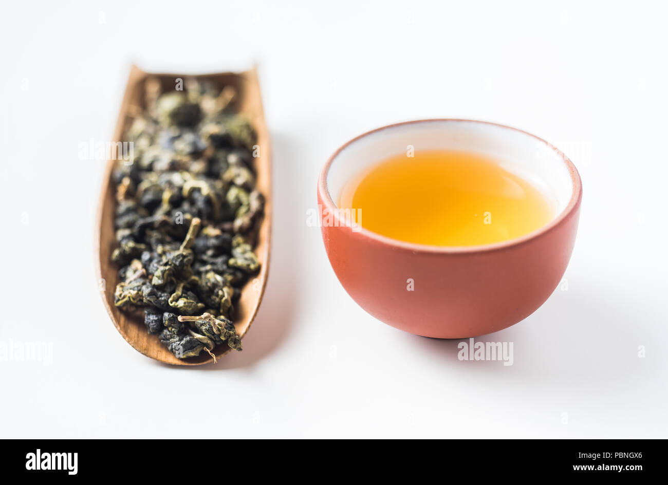 Asia culture and design concept - fresh taiwan oolong tea dry bud and chinese porcelain teacup Stock Photo