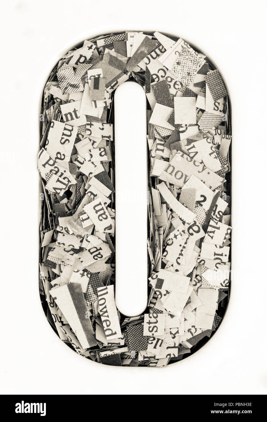 Capital letter made from cut up old newspaper Macro photography Stock Photo